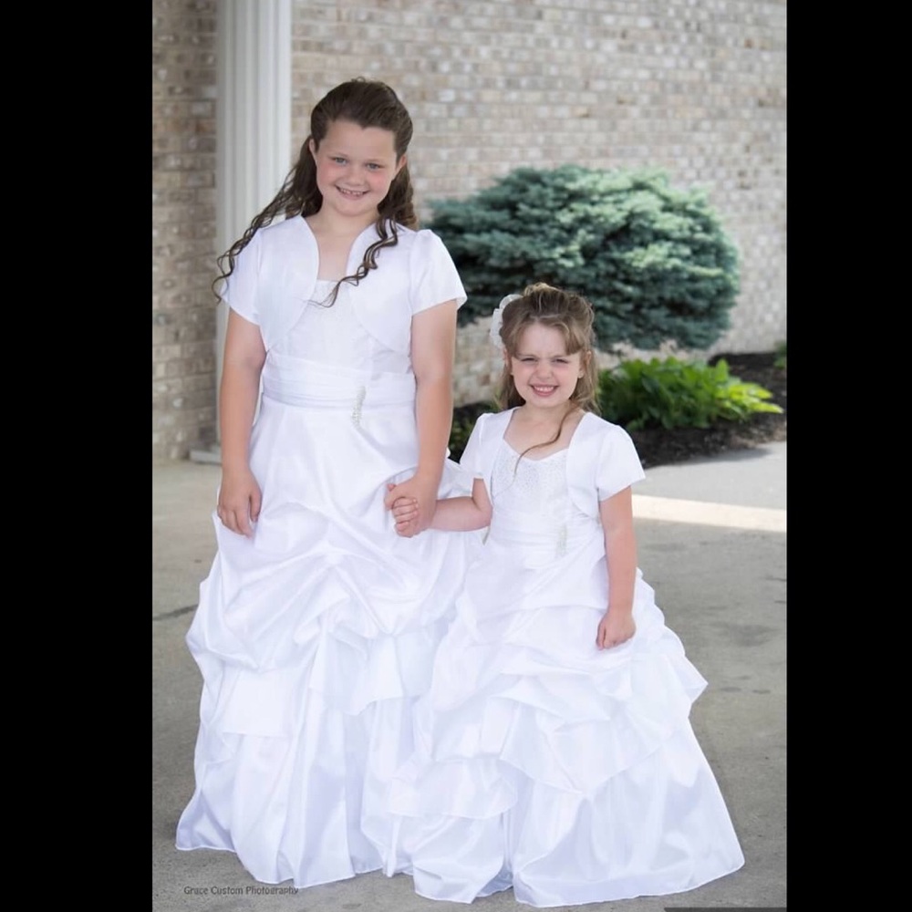 A Flower girl/Junior bridesmaid white poof dress.